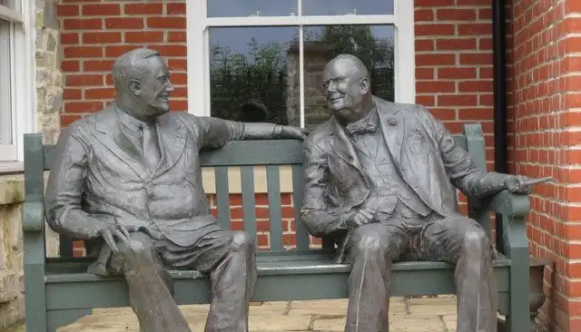 two guys talking statue